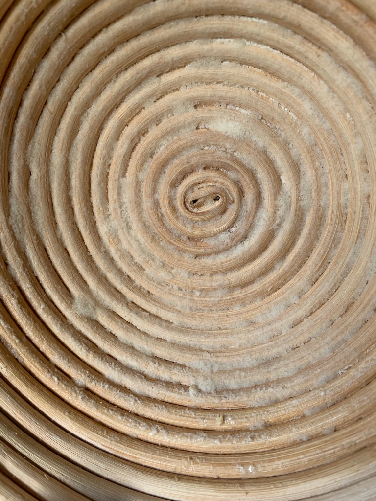 Close up of bamboo banneton. The ridges are filled with damp flour.